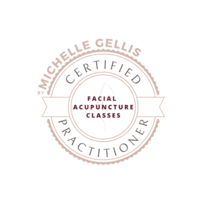 Circular certification logo reading ‘Michelle Gellis Certified Practitioner’ around the outer ring, with ‘Facial Acupuncture Classes’ in the centre and a stylised facial profile illustration, shown in soft pink and white on a transparent background